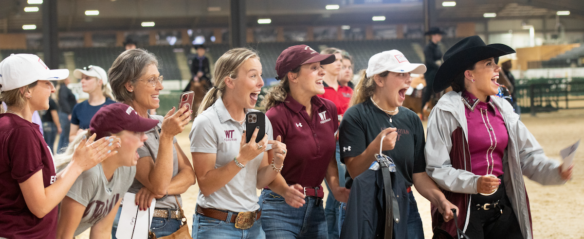 Web copy -Western_WestTexas_Cheering_Kyle copy W Texas A and M cheer on their team.