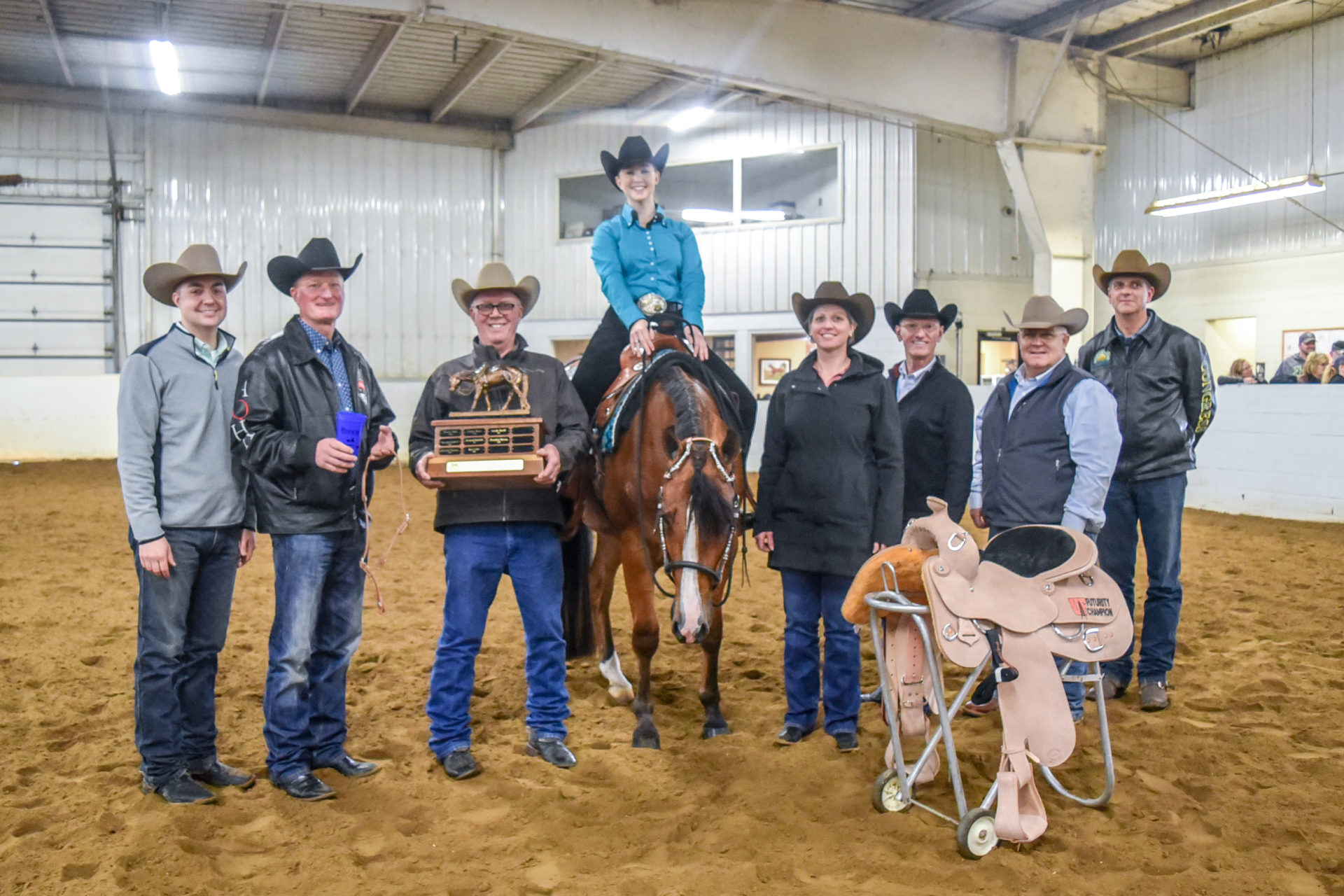 Clark and instructors pose for a picture with the winner of the 2019 Clark Bradley Western Pleasure Futurity, Leah Palm