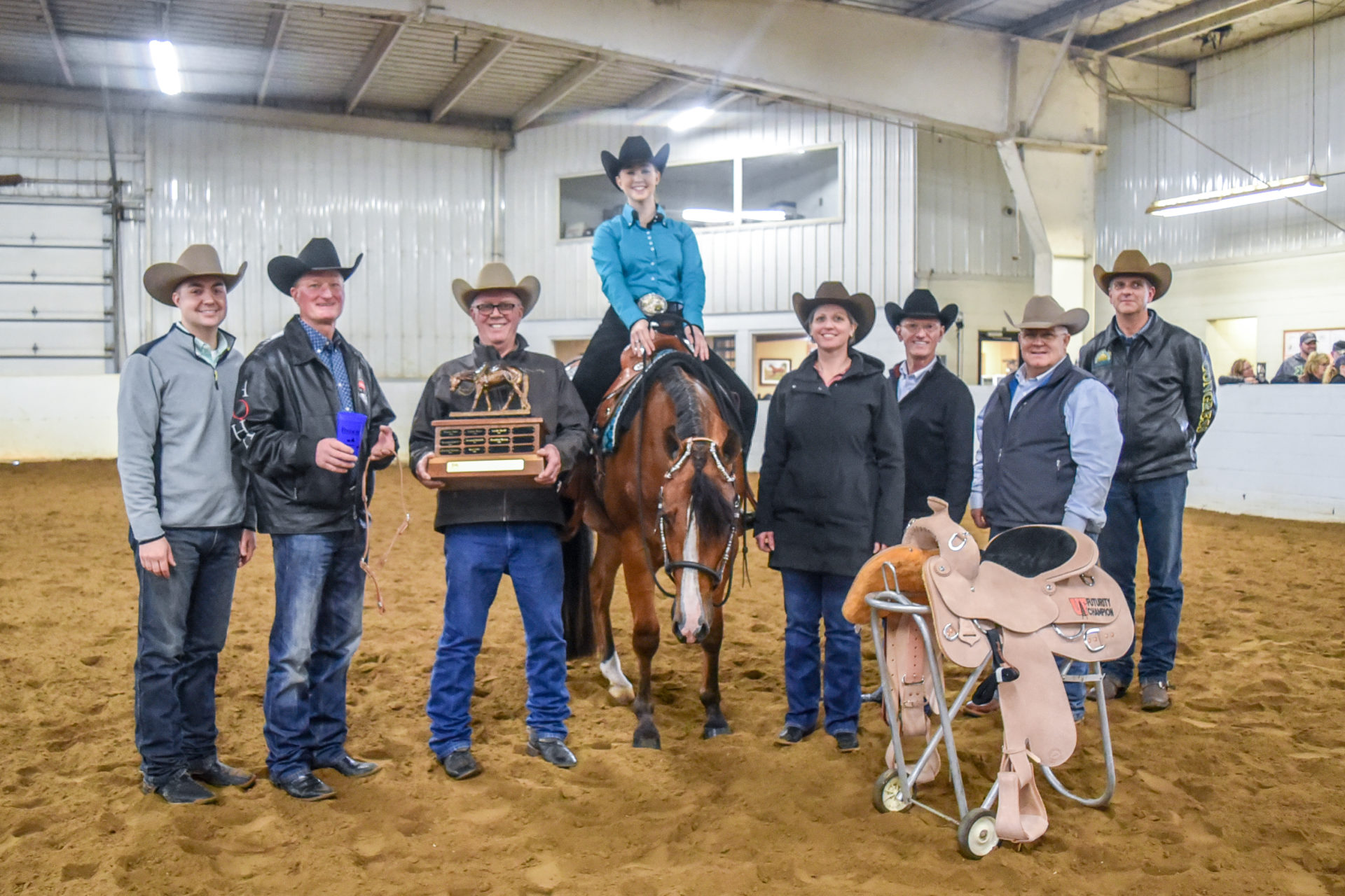 Clark and instructors pose for a picture with the winner of the 2019 Clark Bradley Western Pleasure Futurity, Leah Palm Clark and instructors pose for a picture with the winner of the 2019 Clark Bradley Western Pleasure Futurity, Leah Palm
